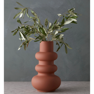 terracotta vase with a modern curved shape