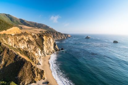 Coastline of central California near Big Sur along US 1 at dusk.