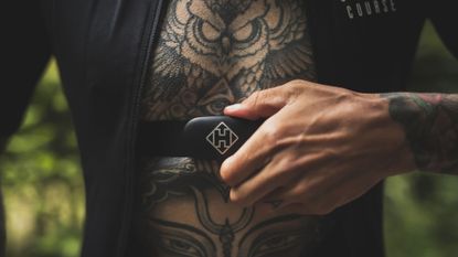Hammerhead Heart Rate Monitor review: Pictured here, a tattooed cyclist wearing the device
