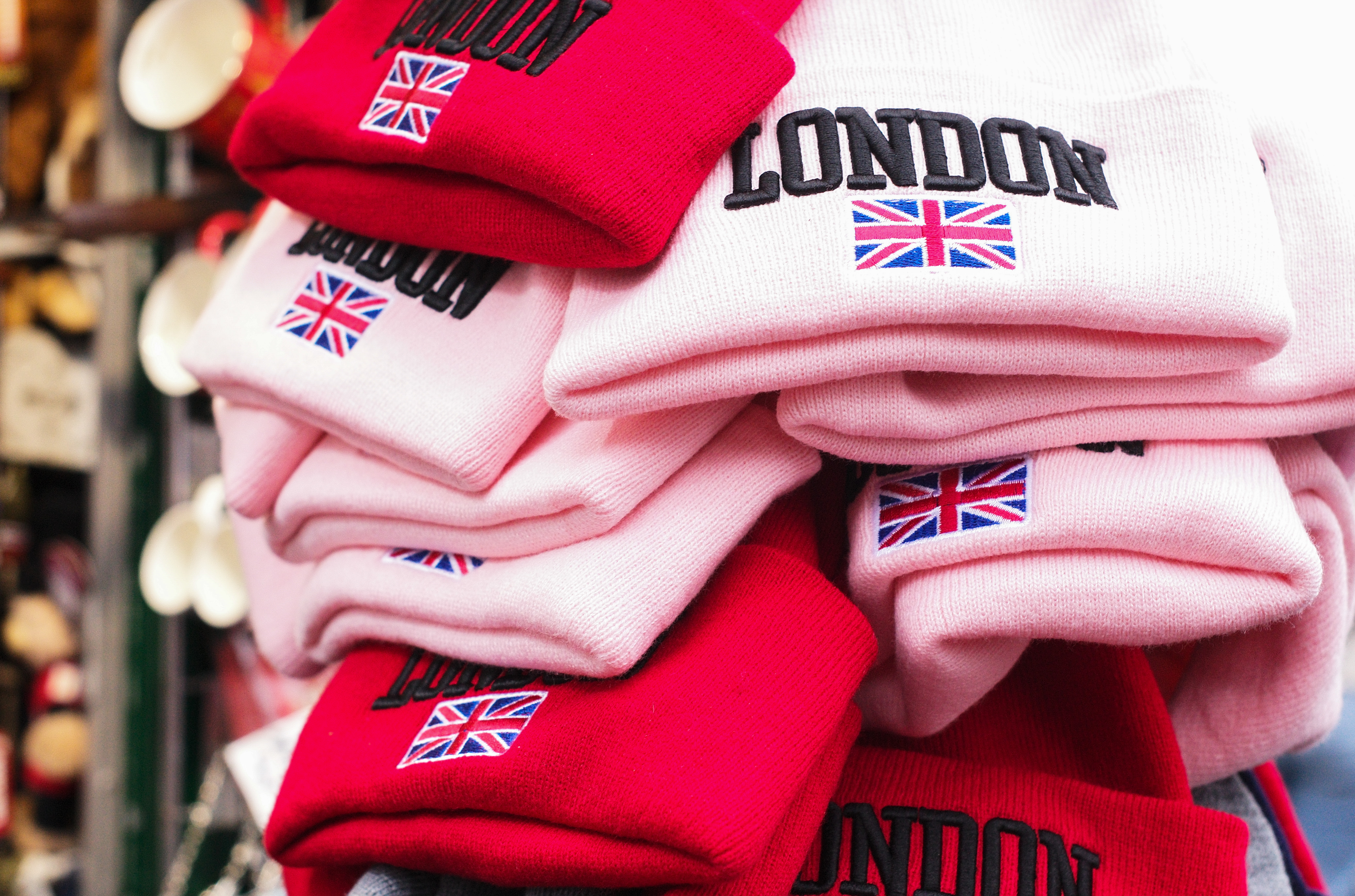 Red and pink hats with London and the Union Jack printed on them