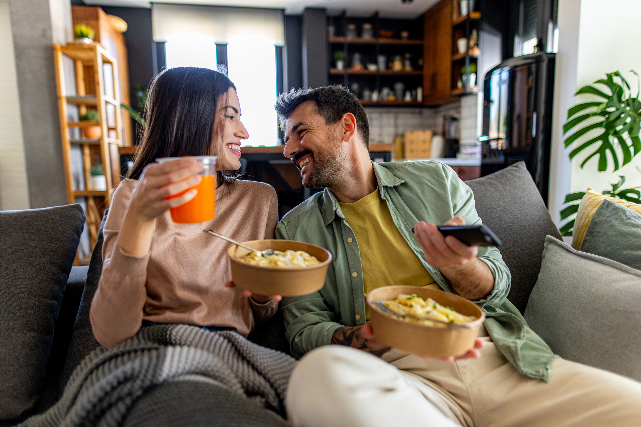 Couple watching Netflix eating take away