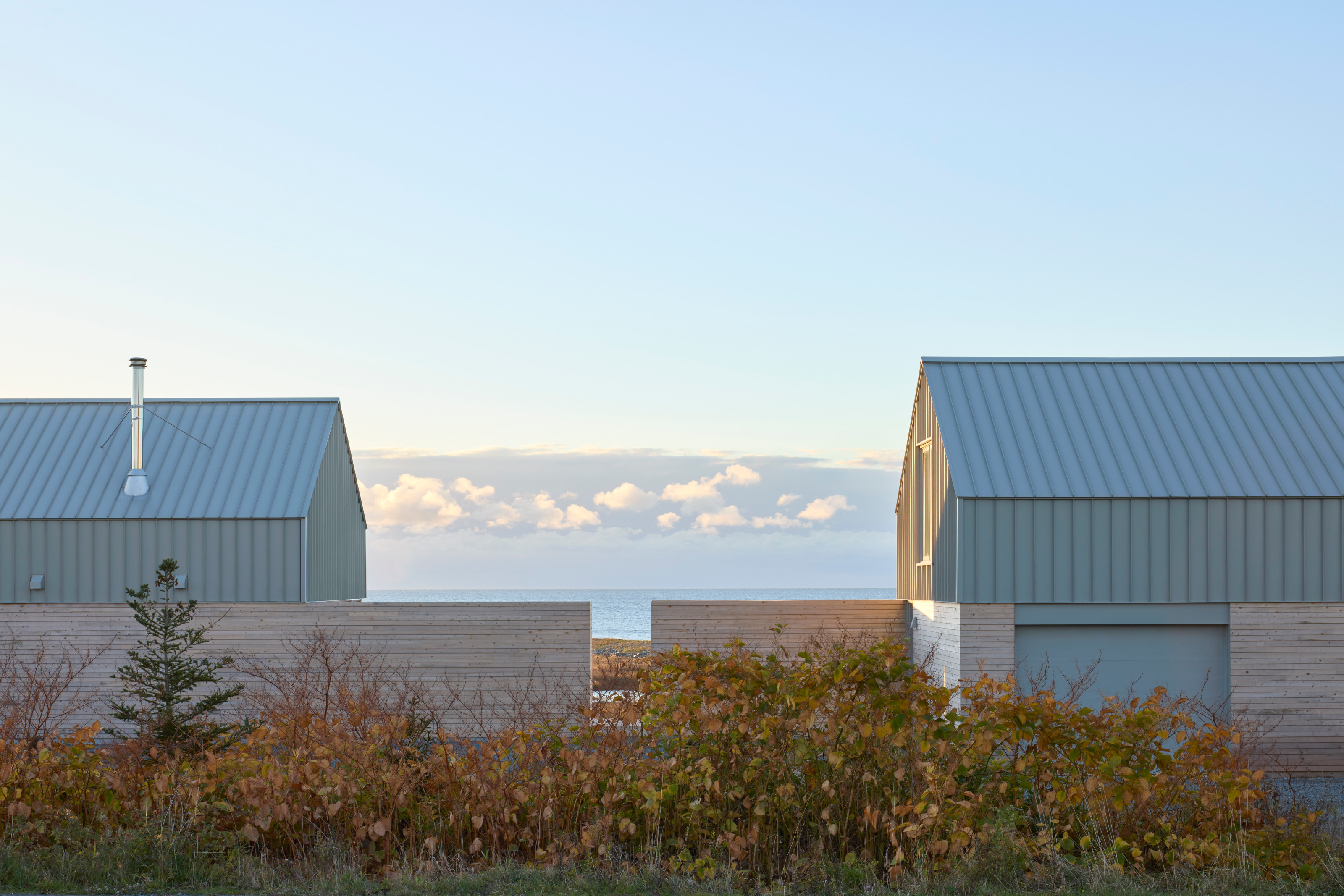 The house is divided into two distinct structures, linked by a wall