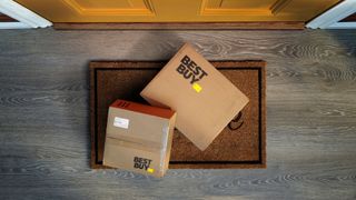 Two Best Buy packages on a doormat