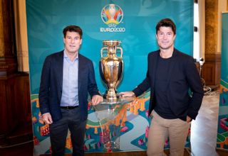 Michael and Brian Laudrup pictured with the European Championship trophy in 2021.