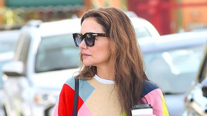 Katie Holmes in bright harlequin jumper and shades