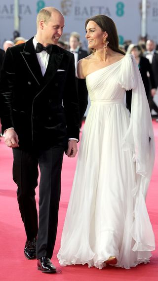 Kate Middleton in a white evening gown with one shoulder