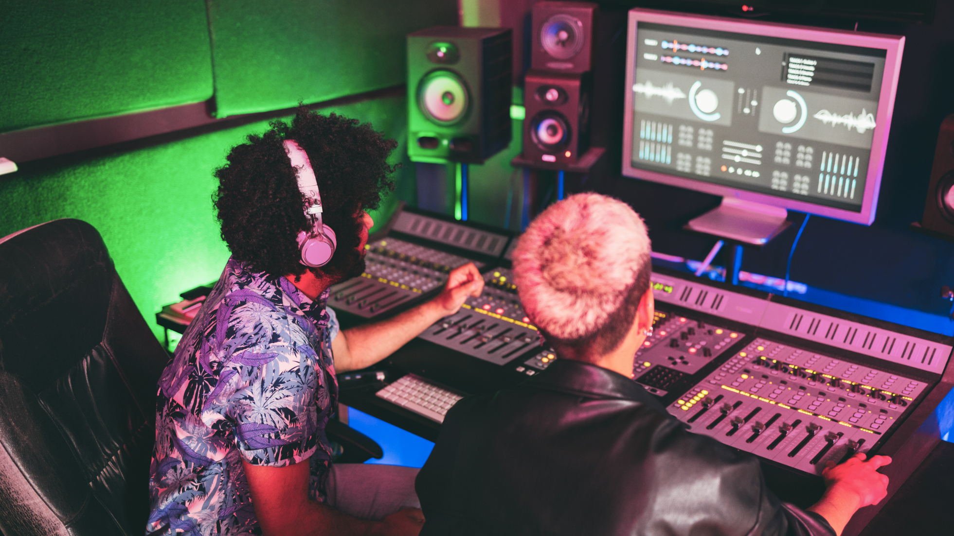 Musician and sound engineer mixing new album inside boutique recording studio
