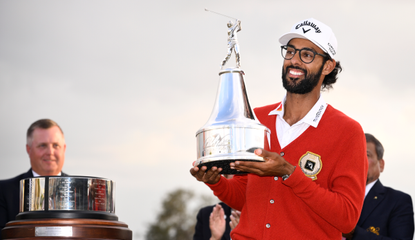 Akshay Bhatia holds the Arnold Palmer Invitational trophy