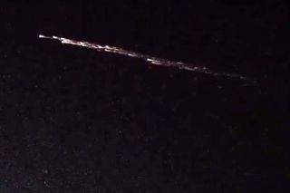 A brilliant fireball created by falling space junk from a Chinese Long March 7 rocket lit up the skies with long fiery streaks.