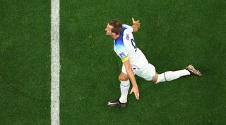 Harry Kane celebrates after scoring for England against Senegal at the 2022 World Cup.