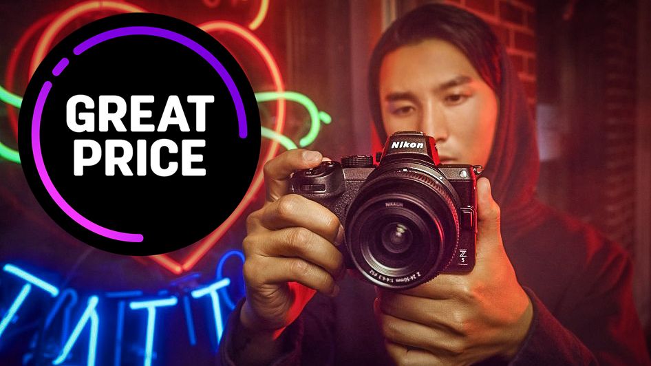 Photographer holding a Nikon Z5 in front of a neon sign, with the text &quot;Great price&quot; in a black bubble