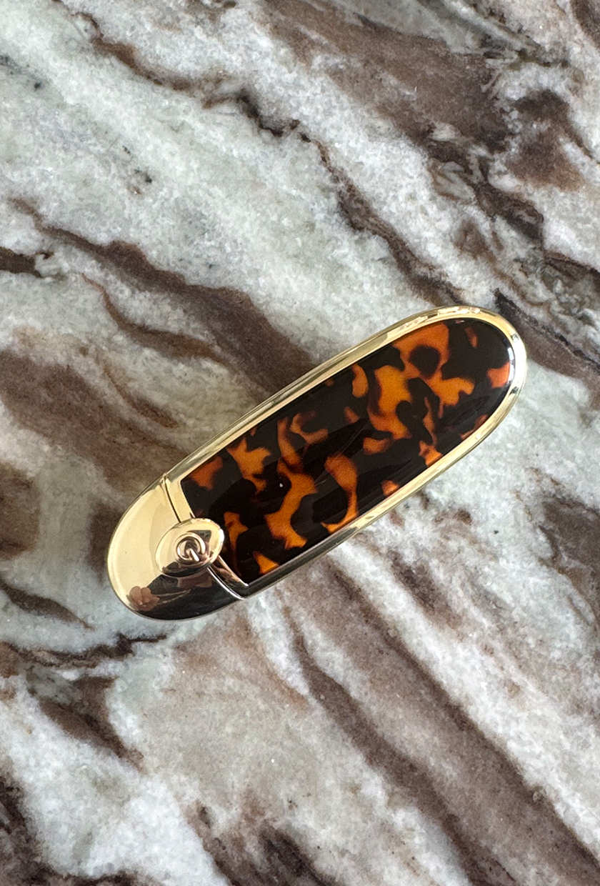 guerlain rouge g lipstick case tortoiseshell on marble table