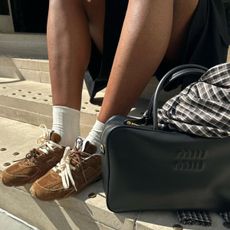 @nlmarilyn wears Miu Miu X New Balance trainers