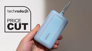 Anker Battery Pack in hand, 10,000mAh blue, next to a logo reading 'Price Cut'
