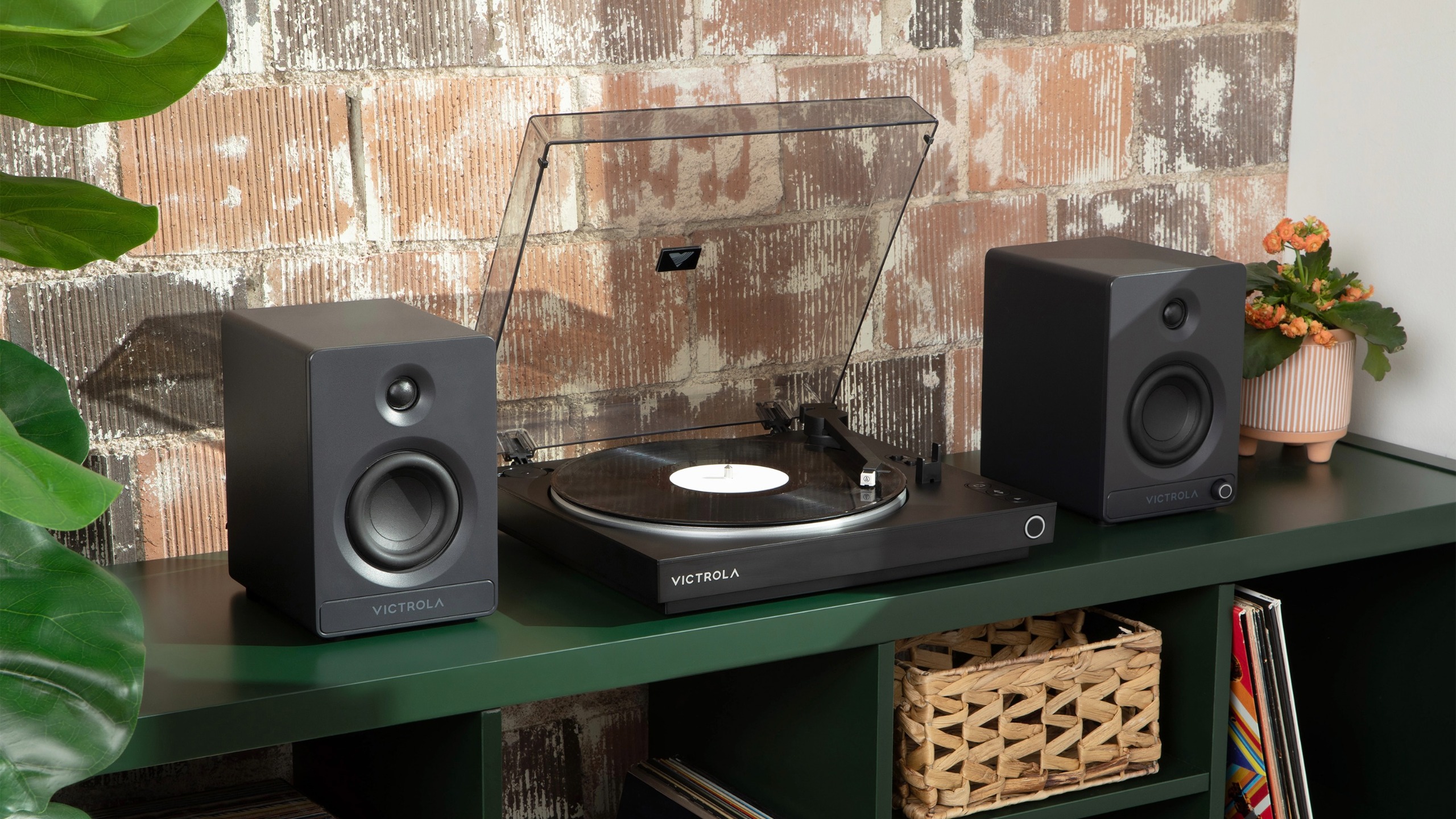 Victrola Automatic turntable next to speakers