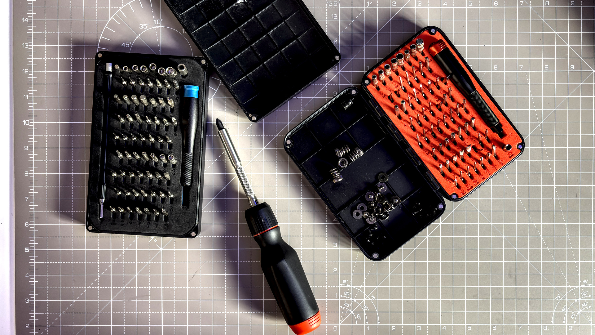 Two screwdrivers on a desk with orange highlights, sold by the YouTube channel Linus Tech Tips, or LTT for short.