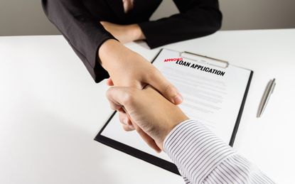 photo illustration of loan agreement