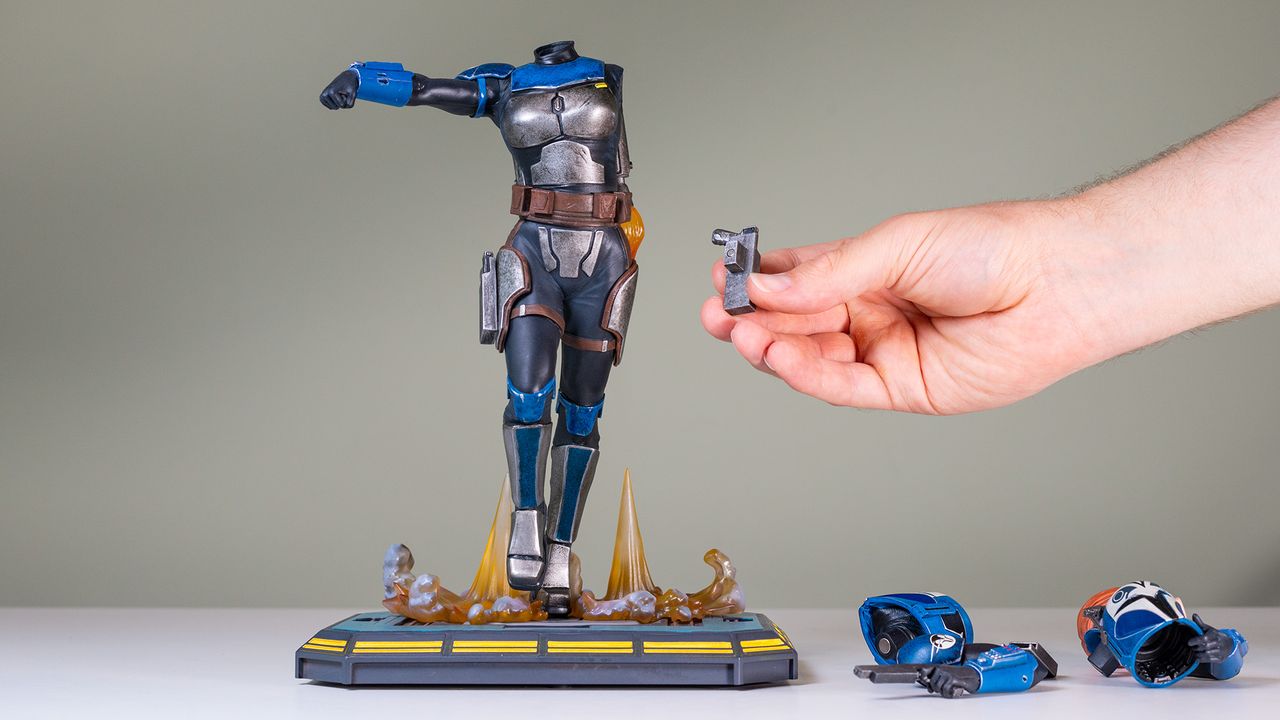 Assembling the Bo-Katan Kryze 1:7 scale statue on a green background