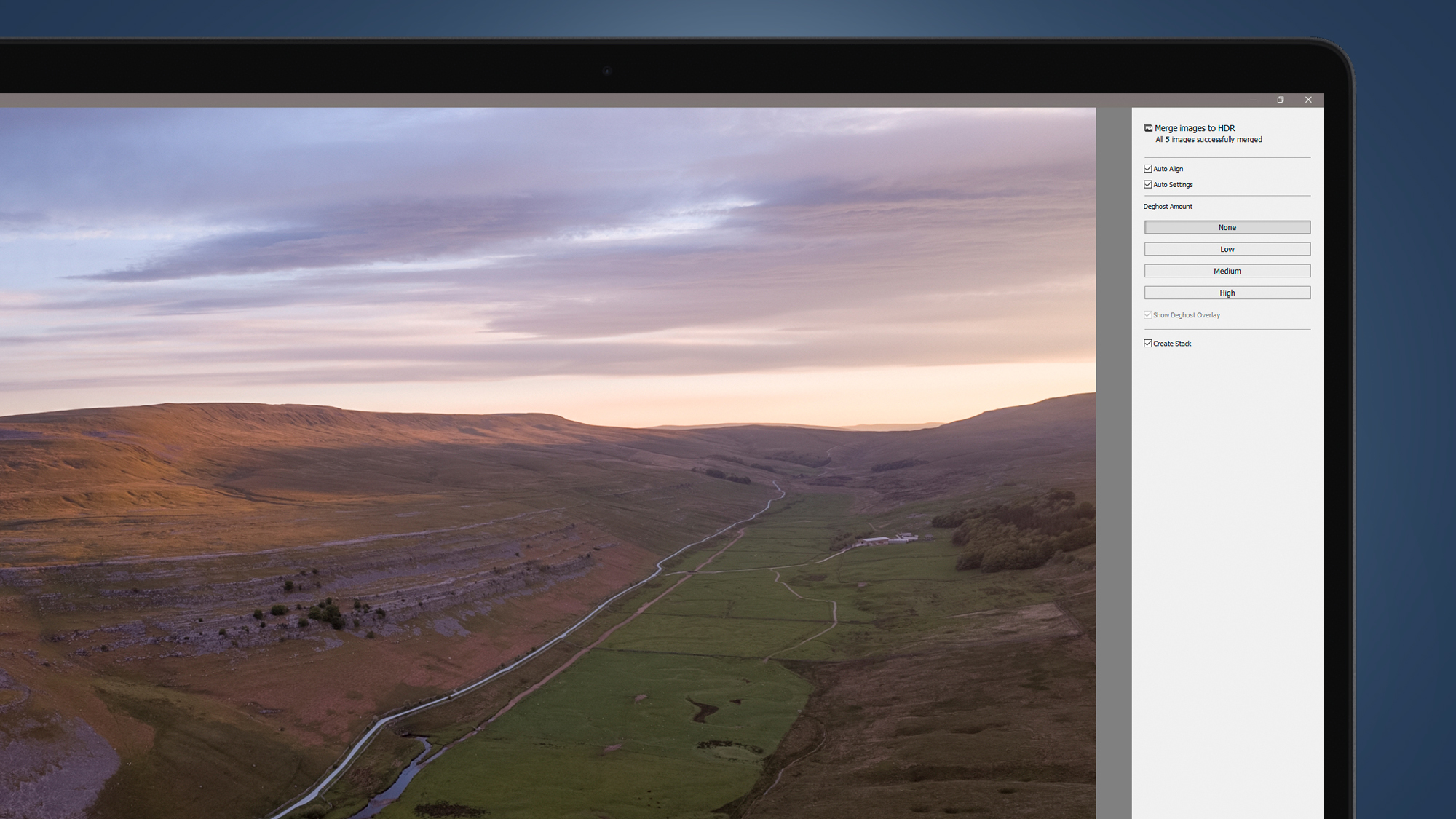 A laptop screen showing an HDR drone photo being blended