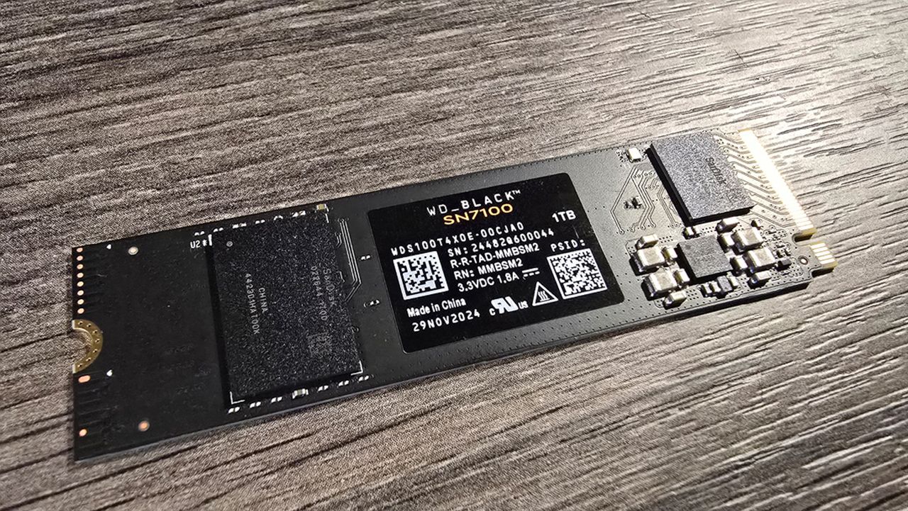 A WD Black SN7100 SSD installed inside a gaming PC.