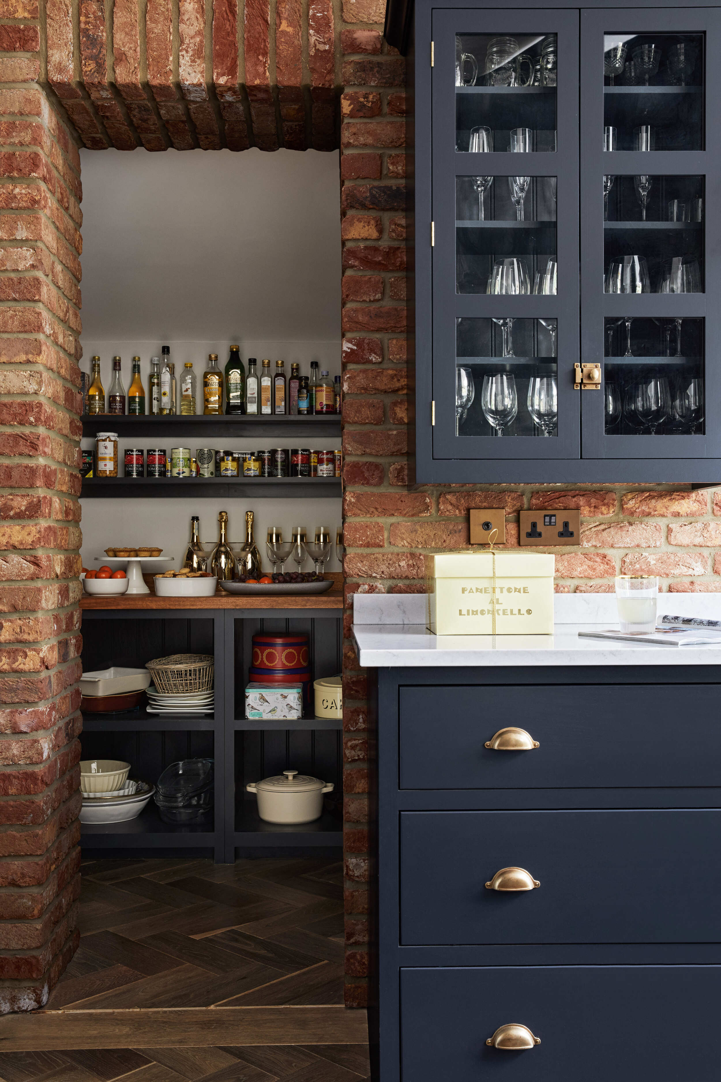 A brick pantry with open shelves