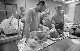 NASA astronauts show journalists some of the rocks they collected during the Apollo 14 mission.
