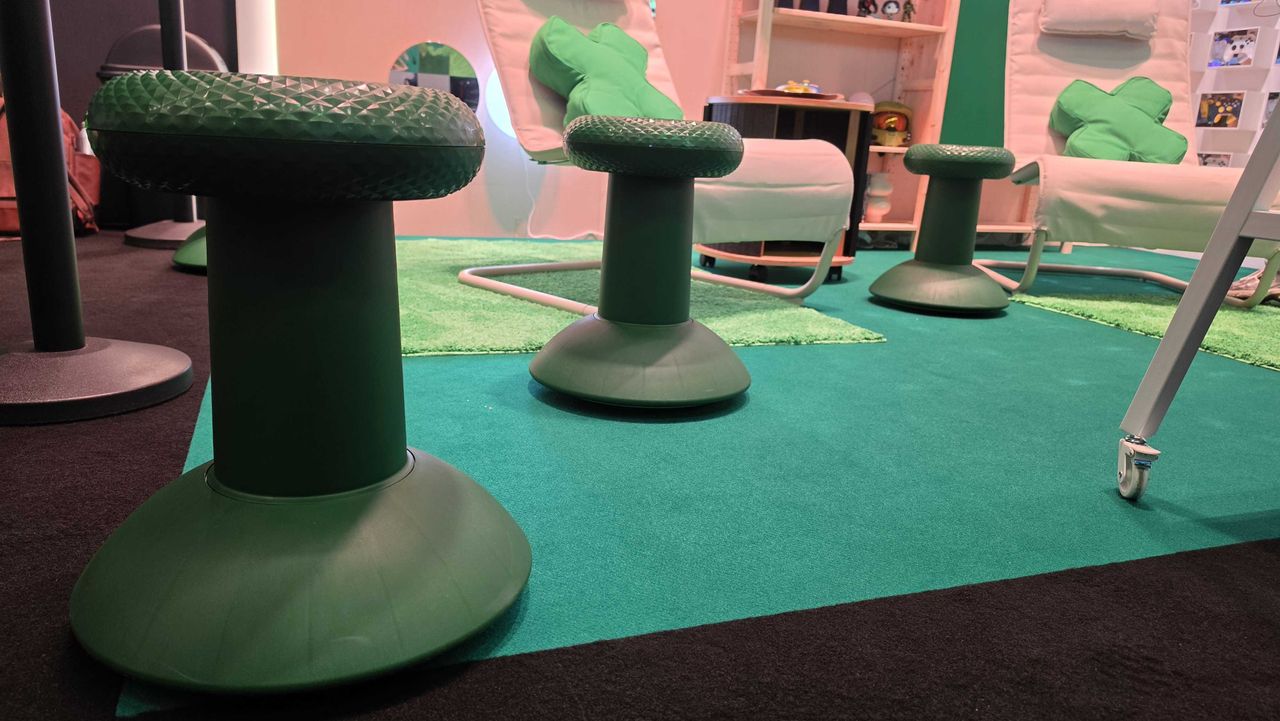A close up of the IKEA x Xbox thumstick stool, with two more stools in the background