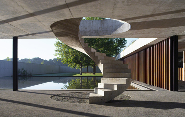 The concrete staircase leads up to a turfed roof, where visitors can settle down to watch a chukka or two