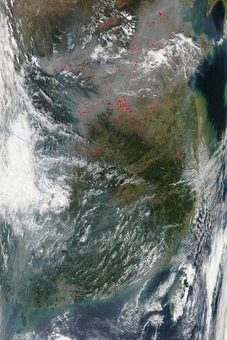 NASA's Aqua satellite captured this image, in which fires in the Chinese countryside appear as red dots, on Oct. 3, 2013.
