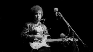 Bob Dylan onstage at the Newport Festival in 1965