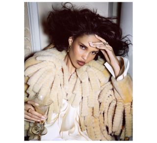 Nara Smith wears Burberry coat with fluffy tassel embellishment.