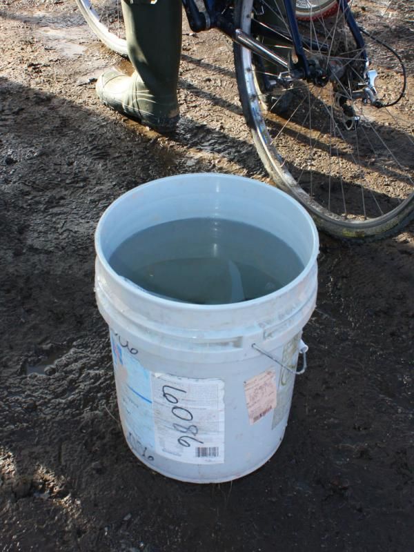 Some teams made do with just a bucket of water to clean up messy bikes.
