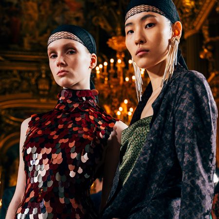 Two models photographed backstage at the Dries Van Noten F/W 25 show in Paris.