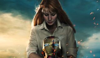 Iron Man 3 Pepper Potts looking at a slashed Iron Man helmet