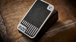 A DOD Mini volume pedal on a wooden floor