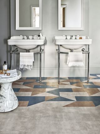 two vanity units with mirrors, vinyl flooring with partial pattern