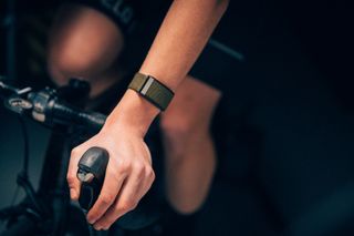 image of a cyclist wearing a WHOOP strap