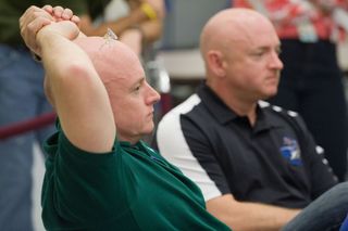NASA Astronauts Mark Kelly and Scott Kelly, identical twins, are pictured participating in the Joint STS-134, Expedition 25 and Expedition 26 International Space Station Emergency Scenario training. At the time, both Kelly brothers planned to be at the space station at the same time for a joint 2011 shuttle-station mission.