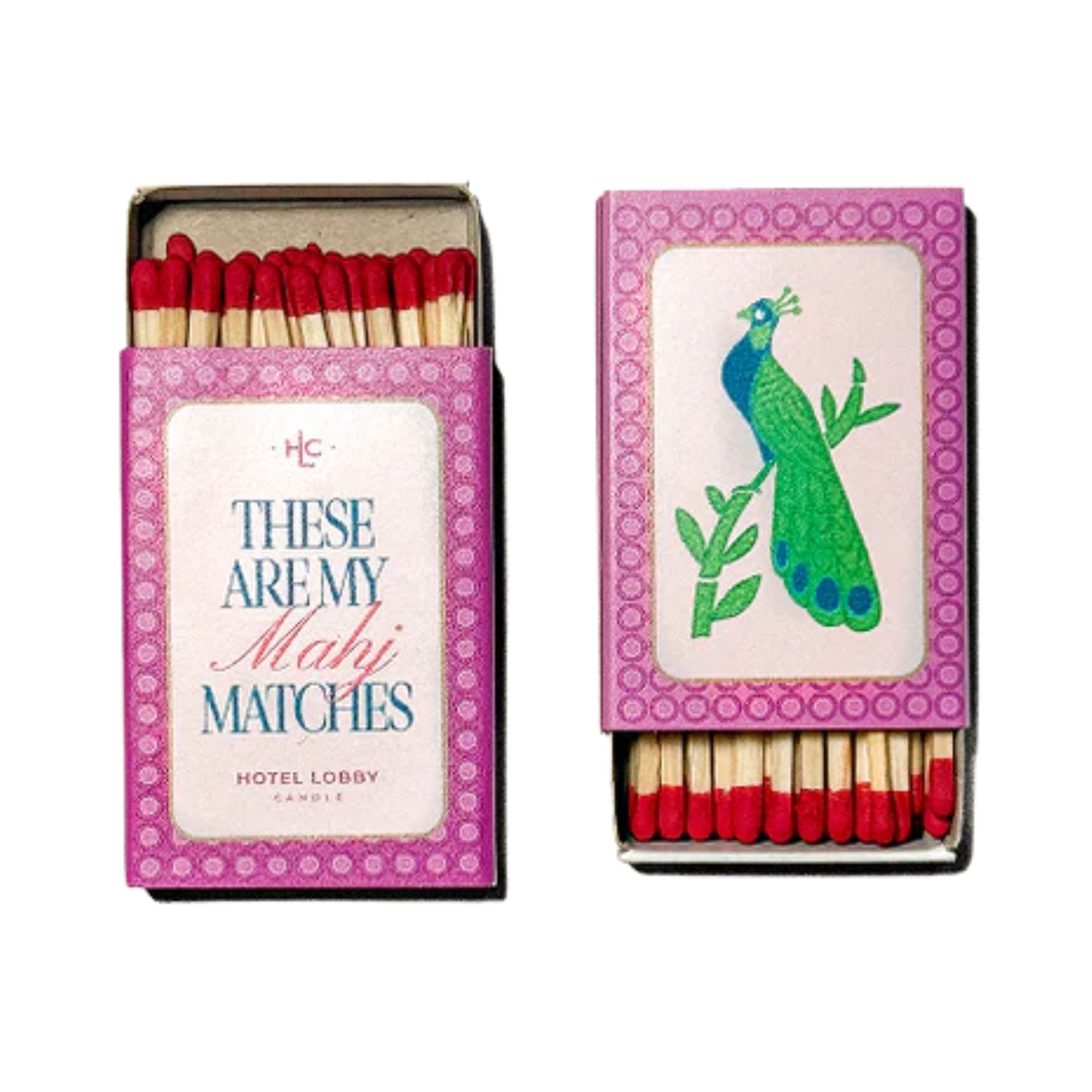 Hotel Lobby x Anthropologie Mahjong matches in a decorative pink box with blue and pink text, and a blue and green peacock.