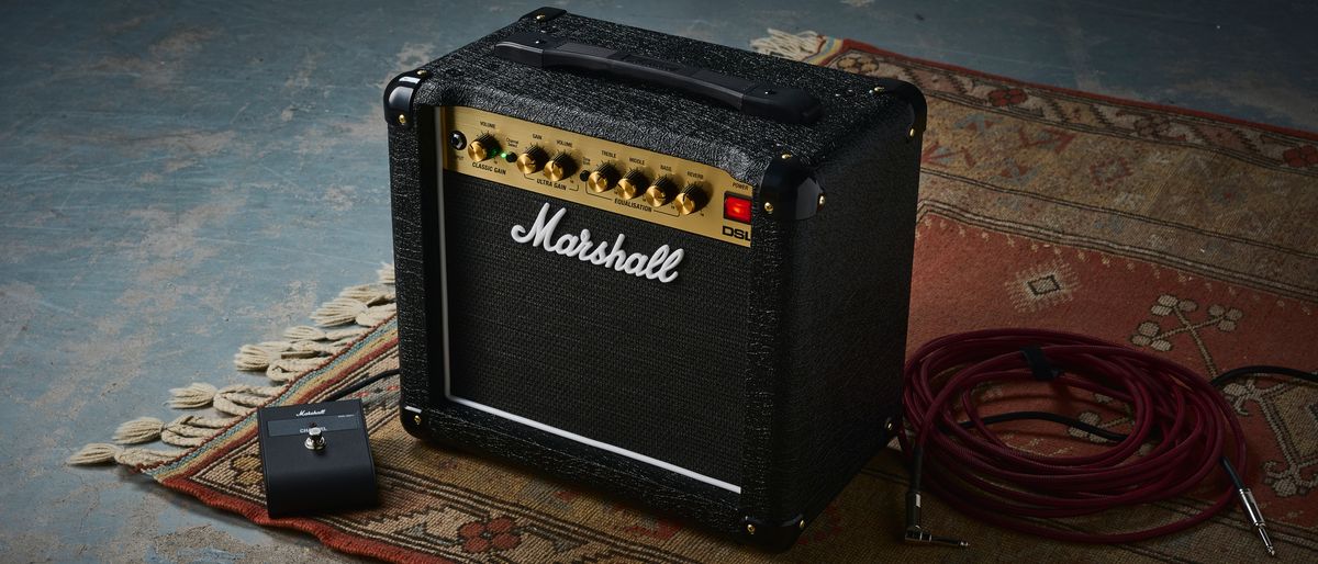 A Marshall DSL1CR tube amp with footswitch and guitar cable on a rug