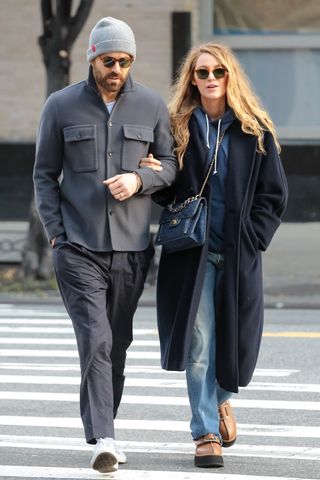 Blake Lively in a blue outfit with Ryan Reynolds