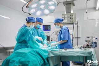 Team of surgeons in operating room at a hospital, by Tempura