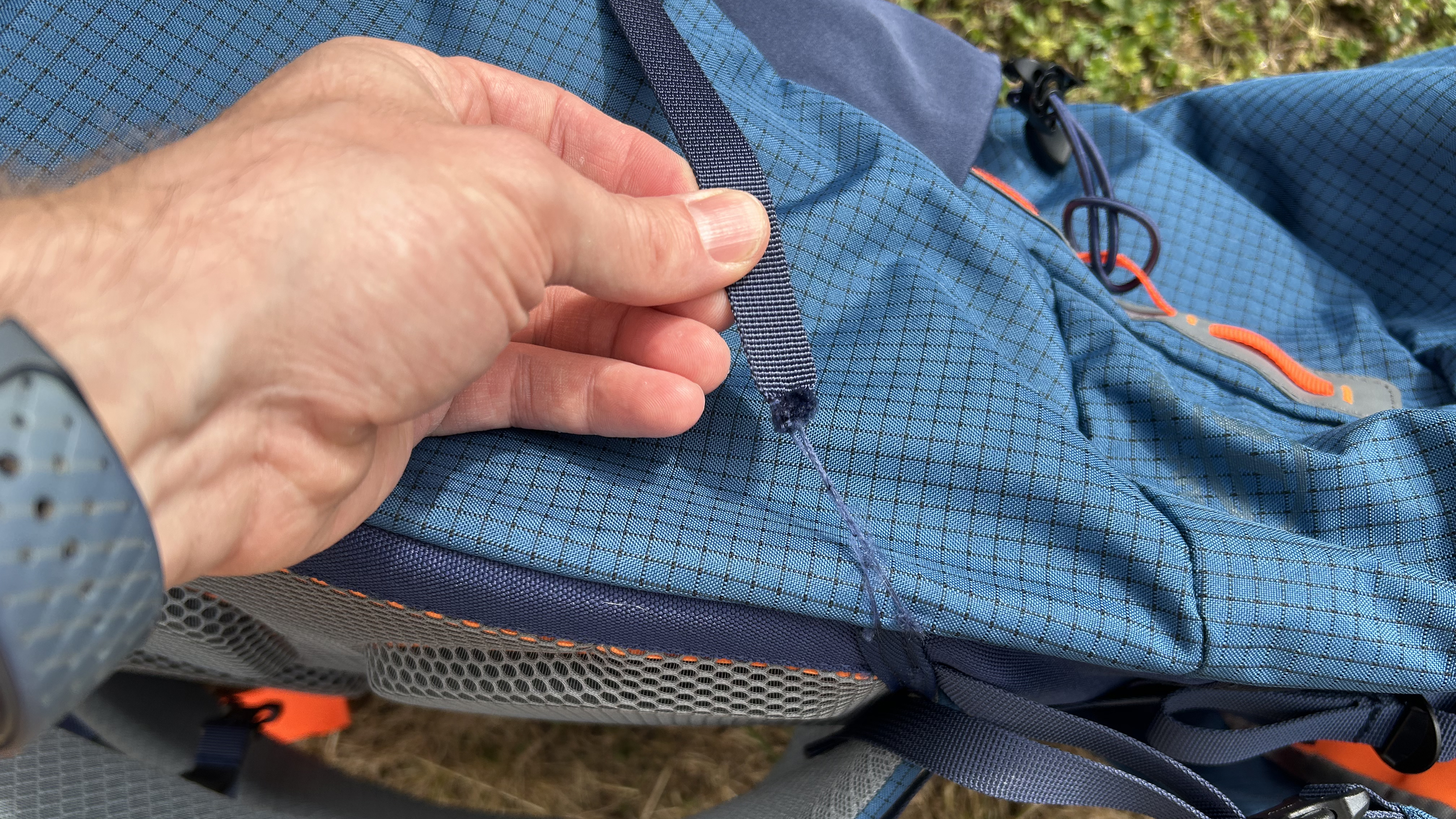Torn compression strap on Vulkan backpack