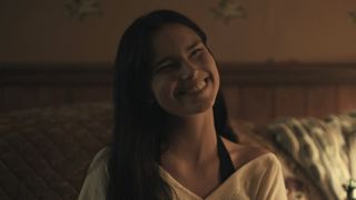 Nikki's squinted-eye smile in Obsession