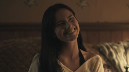 Nikki's squinted-eye smile in Obsession