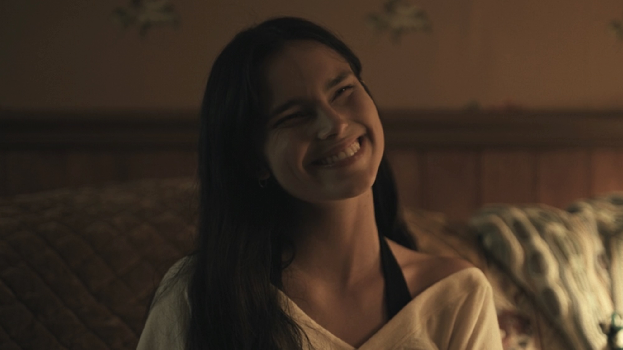 Nikki's squinted-eye smile in Obsession