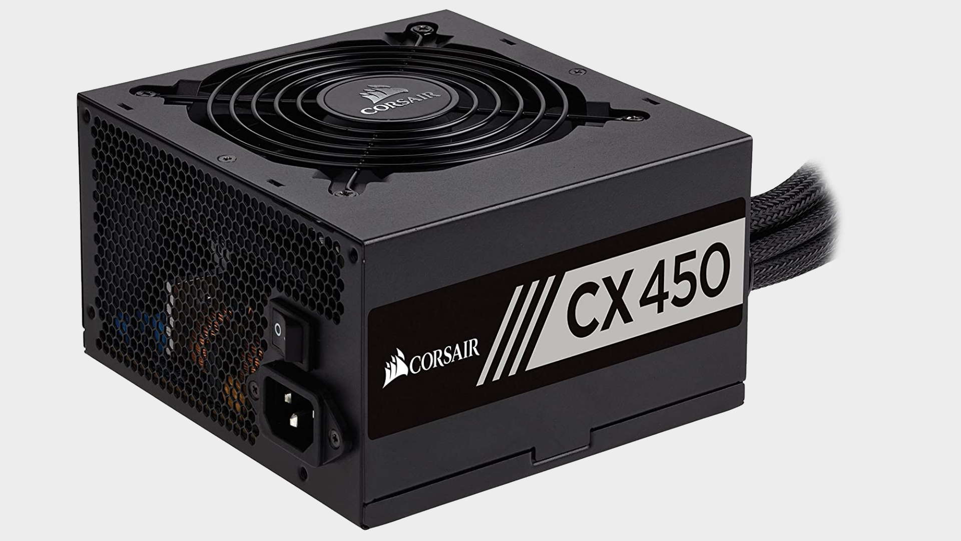 Image of the Corsair CX450 power supply on a grey background.