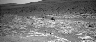 This view from NASA's Opportunity Mars rover, taken on Aug. 3, 2013, shows an area where two geological units abut. The darker unit in the background, believed to be older, marks the edge of "Solander Point," a raised segment of the western rim of Endeavour Crater.