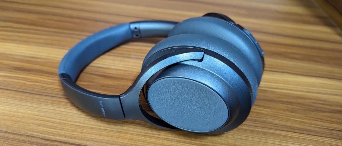 Treblab Z7 Pro wireless headphones on a wooden table.