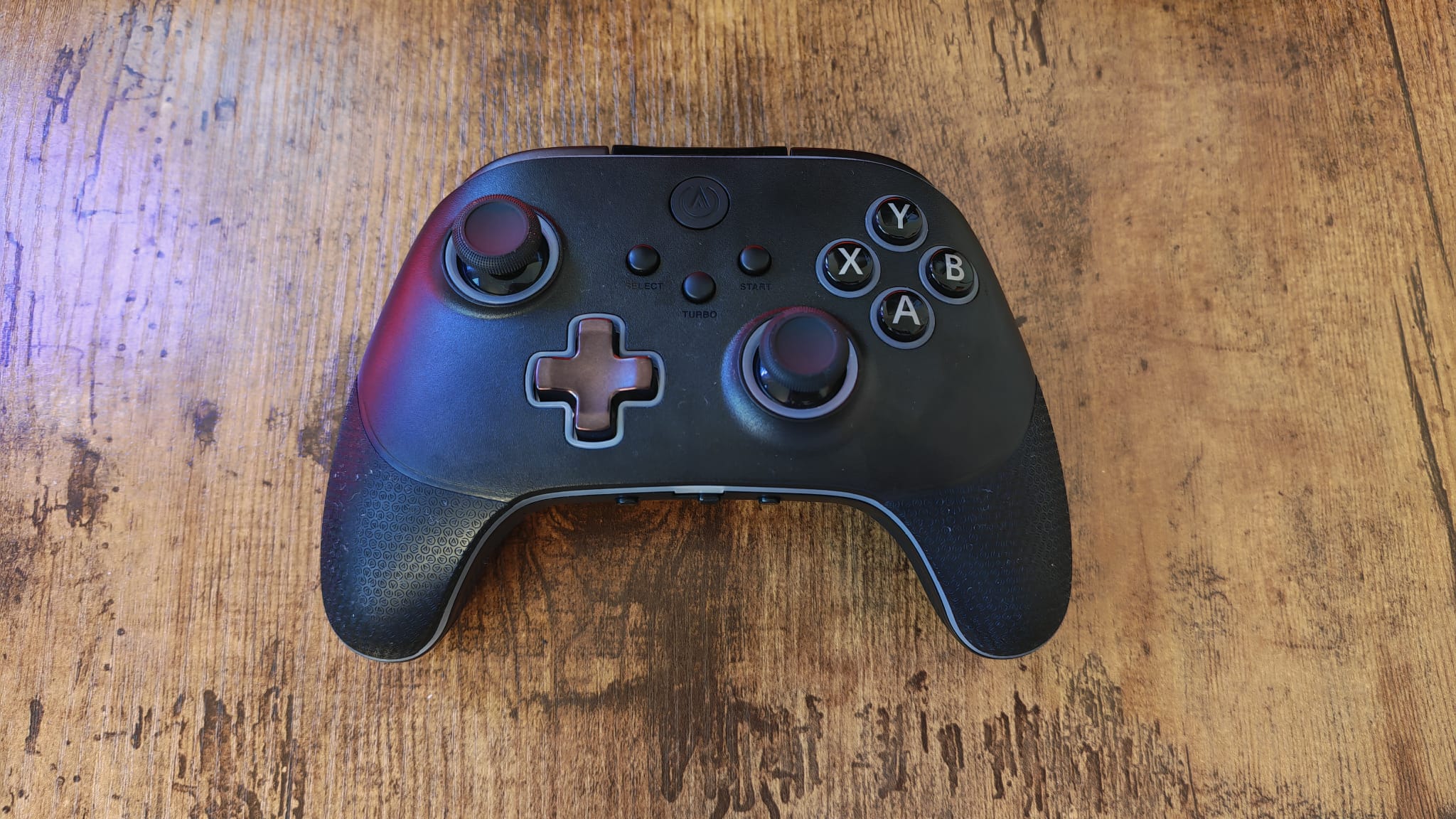 The PowerA OPS V3 on a wooden desktop